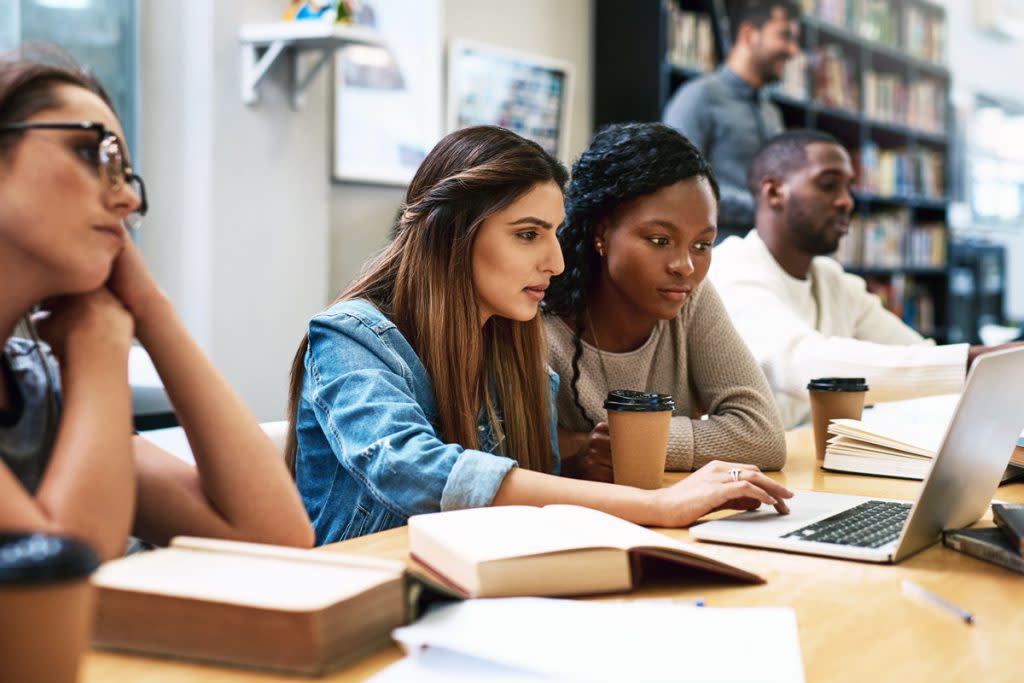 Students prep for college in a a library. 