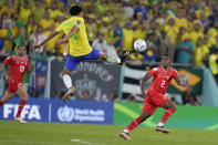 Brazil's Marquinhos jumps for the ball during the World Cup group G soccer match between Brazil and Switzerland, at the Stadium 974 in Doha, Qatar, Monday, Nov. 28, 2022. (AP Photo/Natacha Pisarenko)