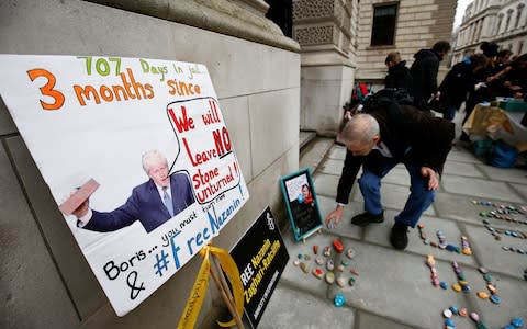 Stones and placards with messages are placed on the pavement outside the Foreign and Commonwealth Office during a demonstration to demand the release of Nazanin Zaghari-Ratcliffe on Sunday - Credit: HENRY NICHOLLS/REUTERS