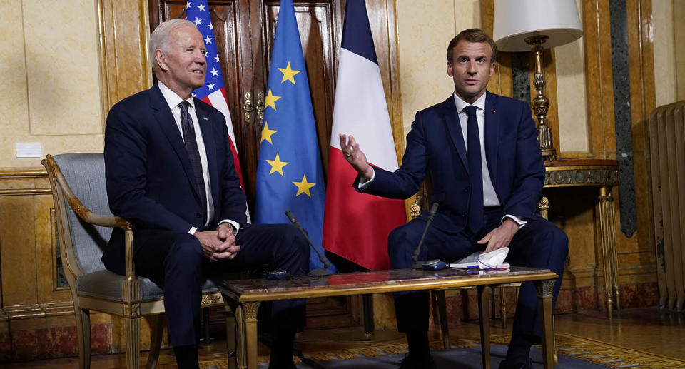 US President Joe Bien French sitting next to President Emmanuel Macron at the G20 summit in Rome.