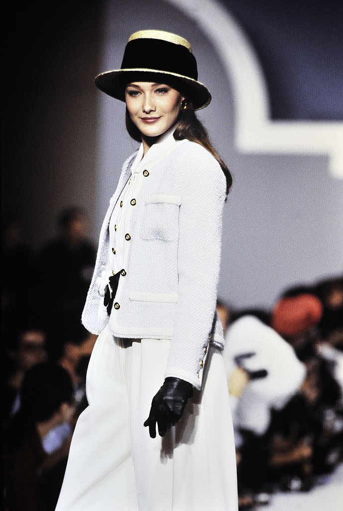 PARIS, FRANCE - OCTOBER 24: Model Carla Bruni-Sarkozy walks the runway during the Chanel Ready to Wear Spring/Summer 1989 show as part of the Paris Fashion Week on October 24, 1988 in Paris,France. (Photo by Victor VIRGILE/Gamma-Rapho via Getty Images)