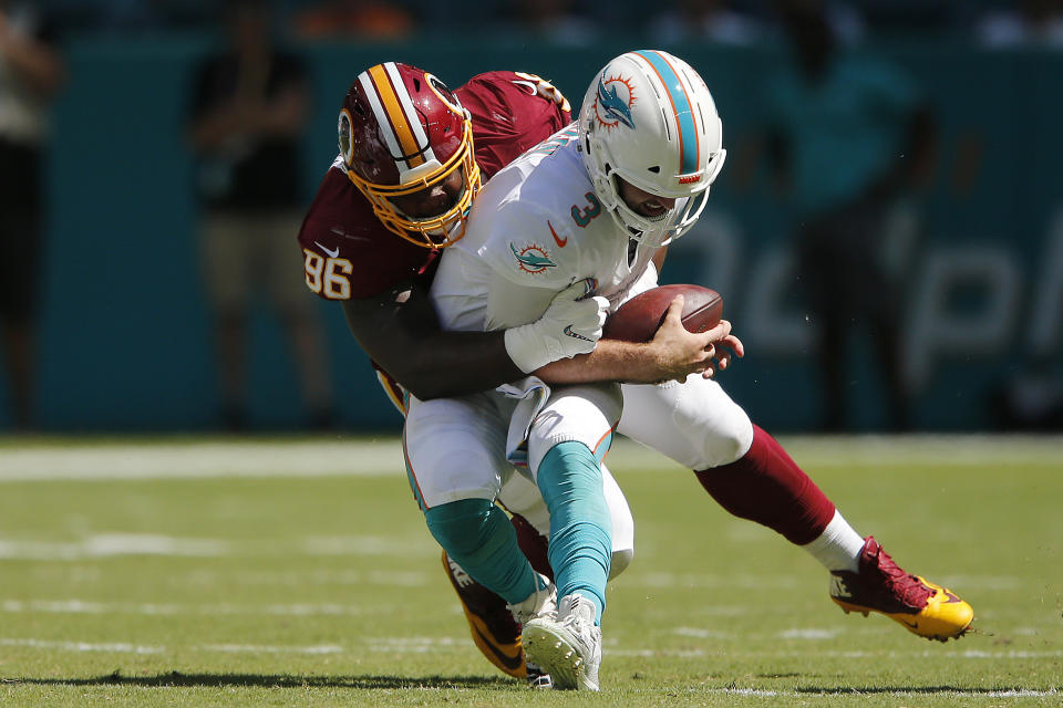 Josh Rosen is sacked in the first half against Washington. (Getty Images)