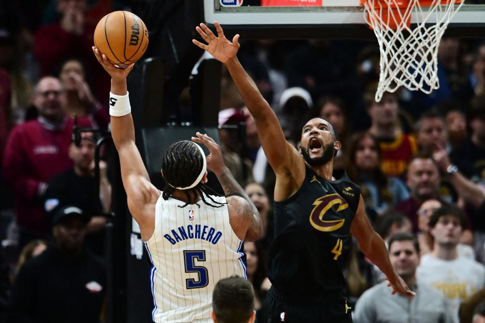Magic forward Paolo Banchero shoots over Cavaliers forward Evan Mobley during the second half in Game 5 of a first-round NBA playoff series, April 30, 2024, in Cleveland.