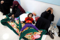 <p>A girl infected with cholera lies on the ground at a hospital in Sana’a, Yemen May 7, 2017. (Khaled Abdullah/Reuters) </p>