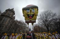 A SpongeBob Squarepants balloon floats down Central Park West during the 88th Macy's Thanksgiving Day Parade in New York November 27, 2014. REUTERS/Eduardo Munoz (UNITED STATES - Tags: SOCIETY)