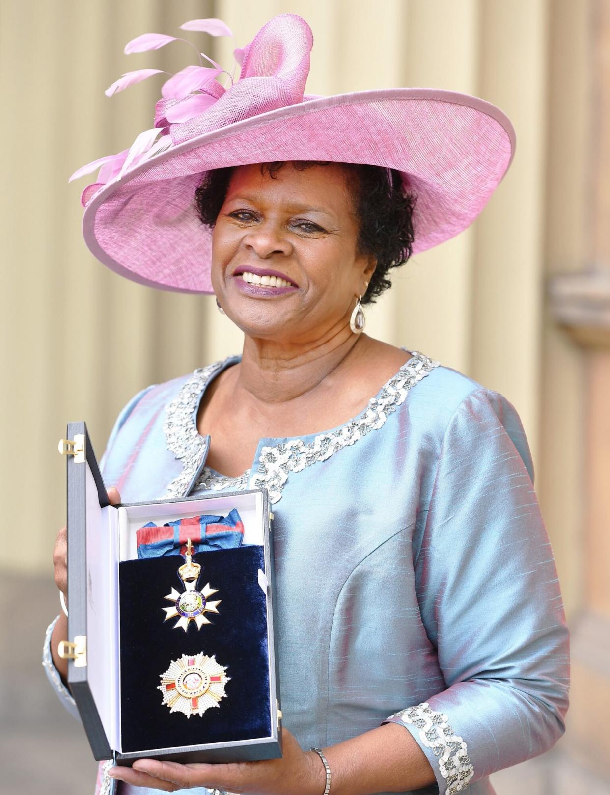 Dame Sandra Mason, governor general of Barbados, holds her Companion of the Order of St Michael and St George (CMG) medal presented at an investiture ceremony at Buckingham Palace in London on March 23, 2018.