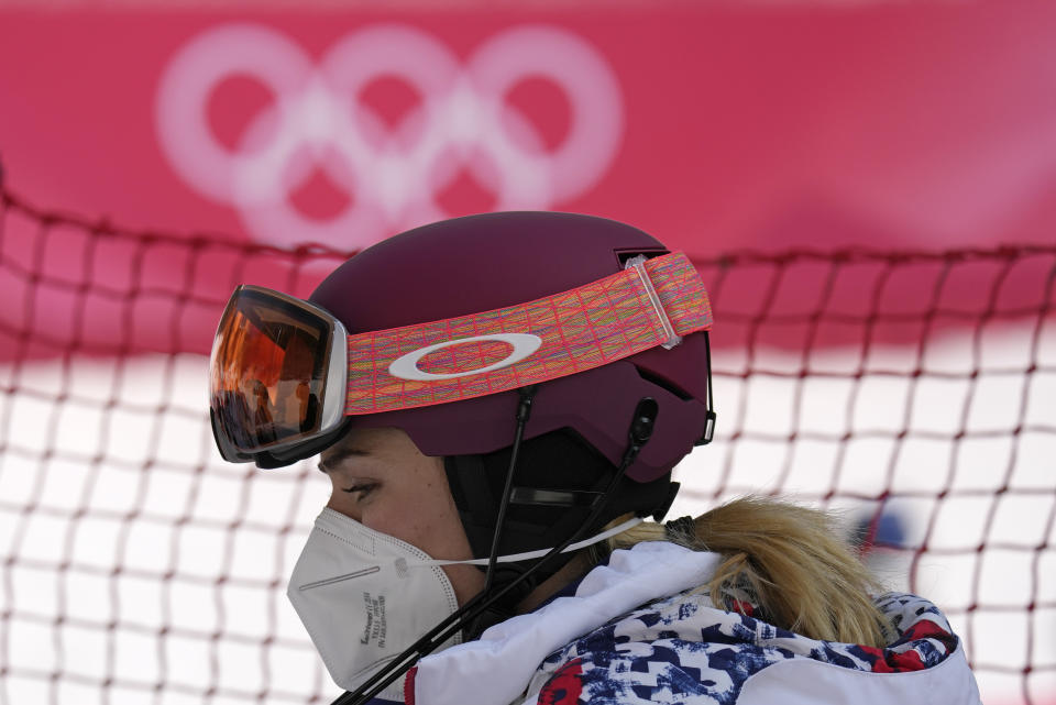 Mikaela Shiffrin, of the United States leaves the finish area after she skied out in the first run of the women's slalom at the 2022 Winter Olympics, Wednesday, Feb. 9, 2022, in the Yanqing district of Beijing. (AP Photo/Luca Bruno)