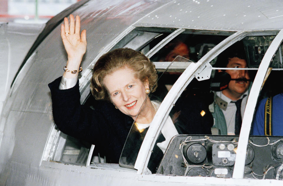 Britain?s Prime Minister Margaret Thatcher waves from the cockpit of a Short SR-3 aircraft at the New Hall of Aviation in Southampton, England on Wednesday, June 10, 1987. Britain goes to the polls in a General Election on Thursday, June 11. (AP Photo/Dave Caulkin)