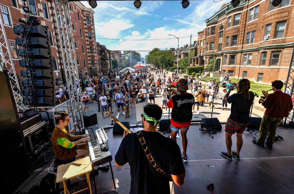 The band Strictly Fine perform on the Forest Stage as people watch, during the Dally in the Alley in Detroit on Saturday, September 10, 2022.