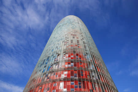 French climber Alain Robert, also known as "The French Spiderman", scales the 38-story skyscraper Torre Agbar in Barcelona, Spain, November 25, 2016. REUTERS/Albert Gea