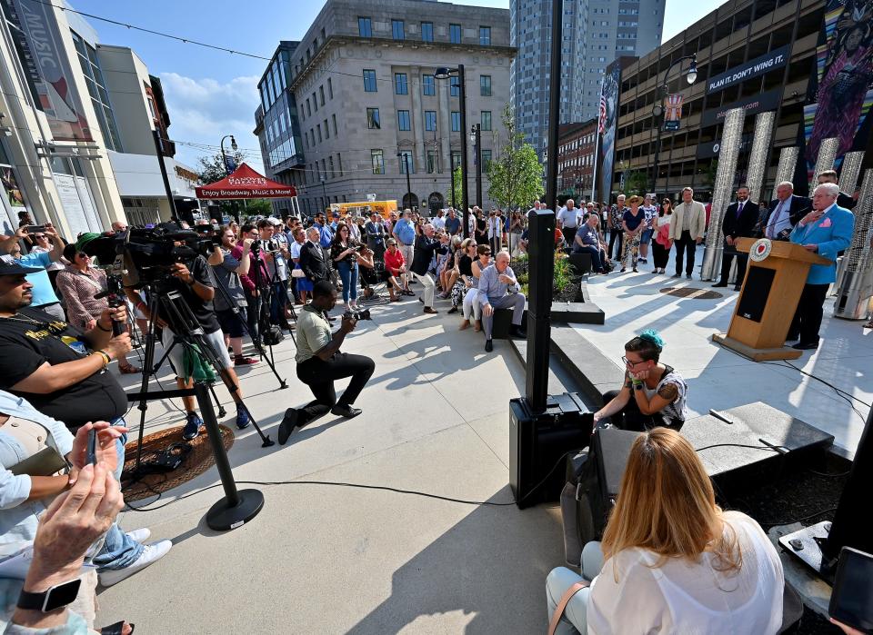 Frank Carroll addresses the crowd during the rededication of the Francis R. Carroll Plaza.