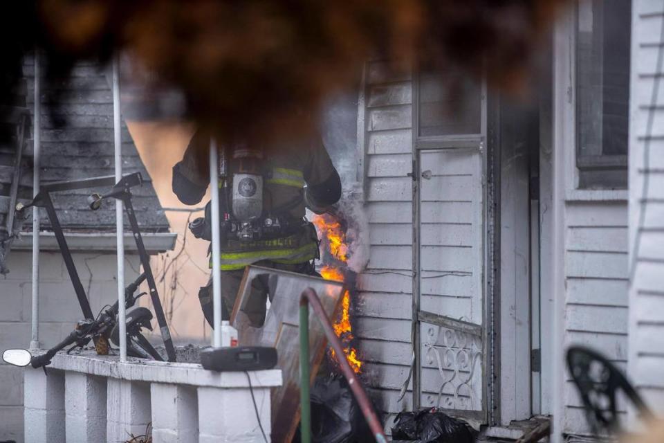 Members of the Lexington Fire Department battle a structure fire on East Seventh Street in Lexington, Ky., on Wednesday, Feb. 8, 2023.