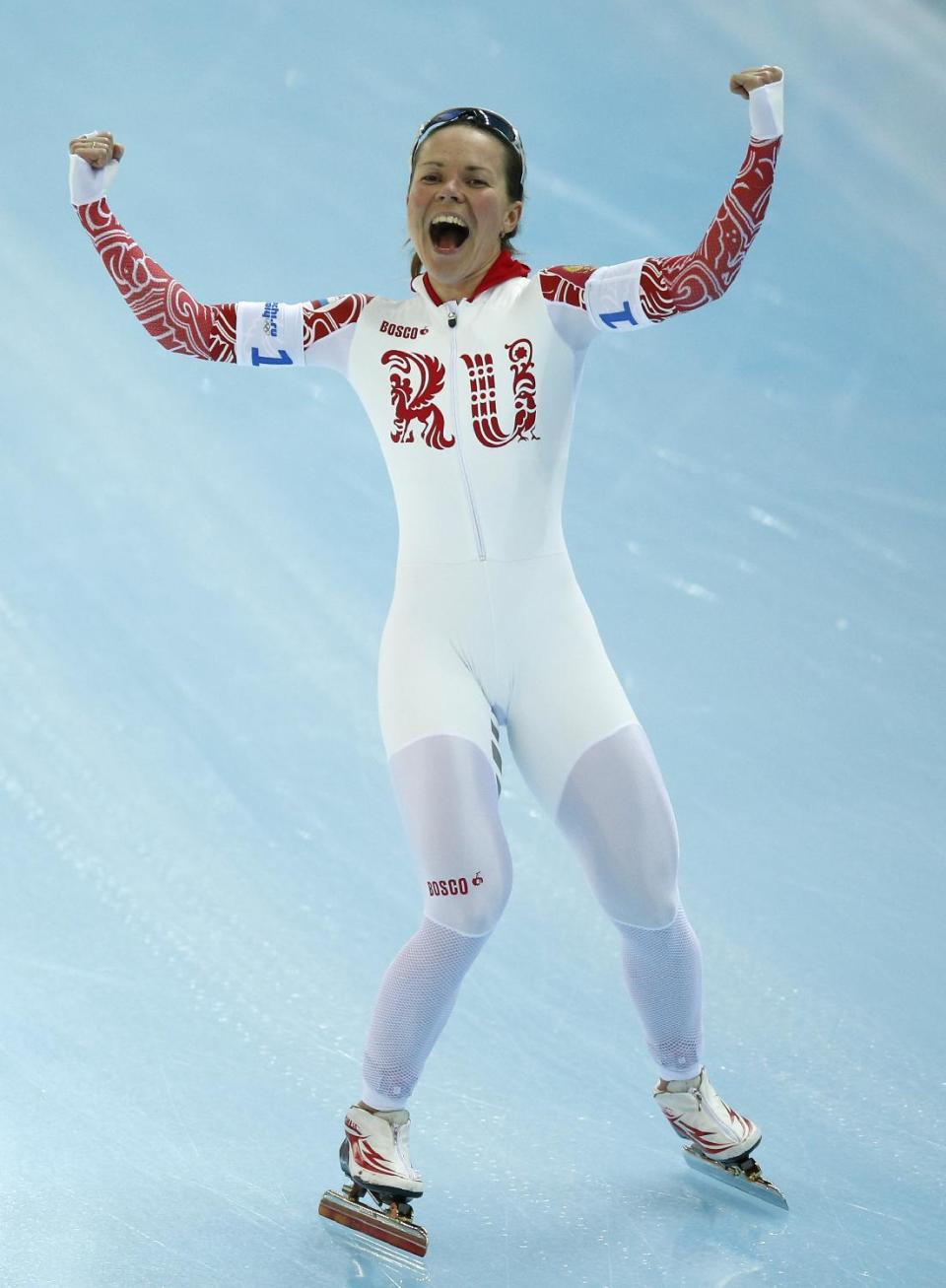 Olga Graf of Russia celebrates after competing in the women's speedskating team pursuit quarterfinals at the Adler Arena Skating Center during the 2014 Winter Olympics in Sochi, Russia, Friday, Feb. 21, 2014. (AP Photo/Pavel Golovkin)