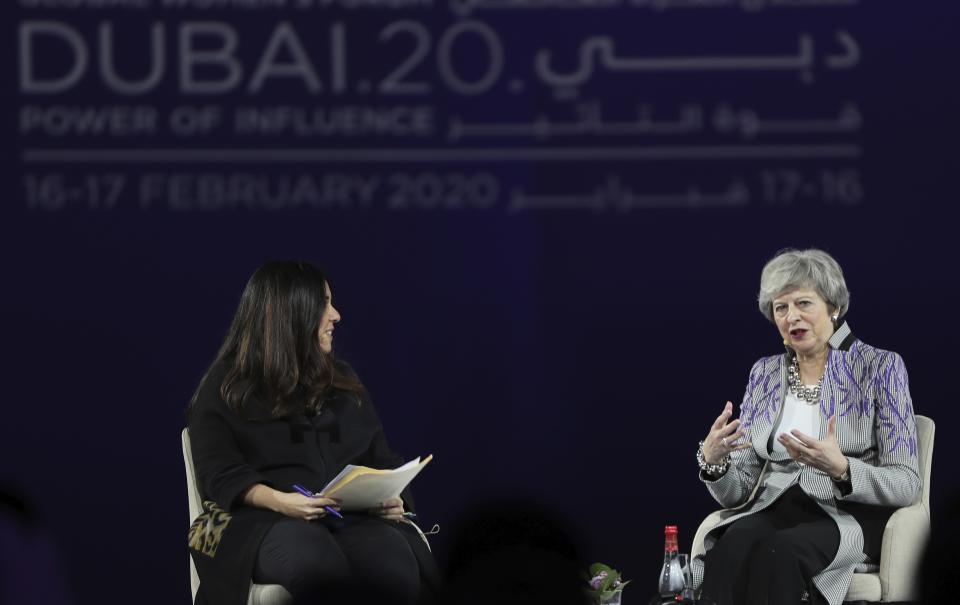 Former British Prime Minister Theresa May, right, participates in the Global Women's Forum in Dubai, United Arab Emirates, Monday, Feb. 17, 2020. (AP Photo/Kamran Jebreili)