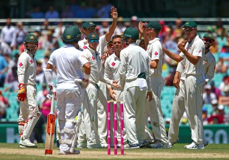 Cricket - Australia v Pakistan - Third Test cricket match - Sydney Cricket Ground, Sydney, Australia - 7/1/17 Australia's Josh Hazlewood gestures to Pakistan's Yasir Shah as he stands at his crease after being caught out. REUTERS/David Gray