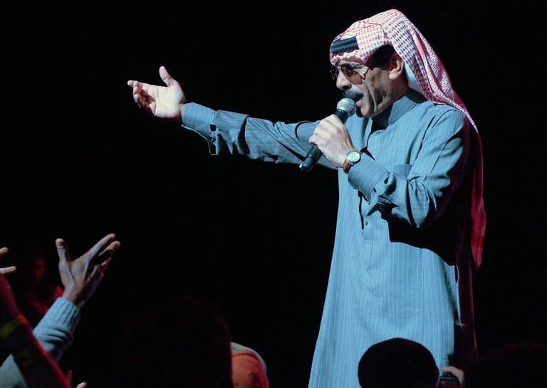 Syrian singer Omar Souleyman performs in the early hours of March 16, 2013 at a benefit concert for victims and refugees of the conflict in his homeland during the South by Southwest (SXSW) festival in Austin, Texas. Souleyman, now living as a refugee with his family in Turkey, will remain in the United States for the coming days to record a new album in New York, his manager said