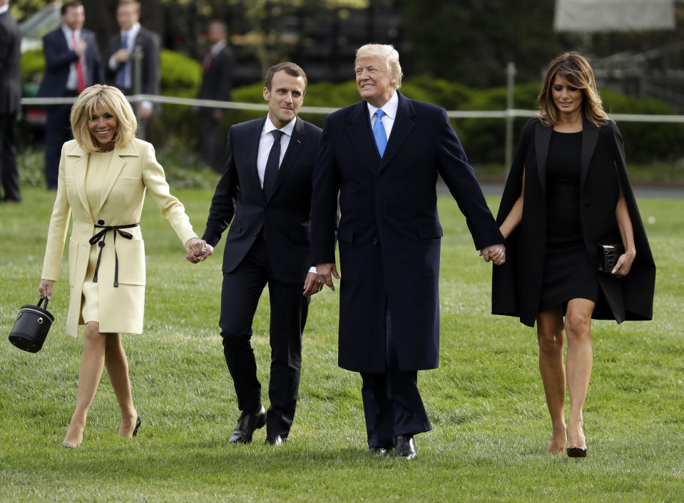 President Donald Trump and first lady Melania Trump greet French President Emmanuel Macron and his wife Brigitte Macron at the White House, Monday, April 3, 2018, in Washington. (AP Photo/Evan Vucci)