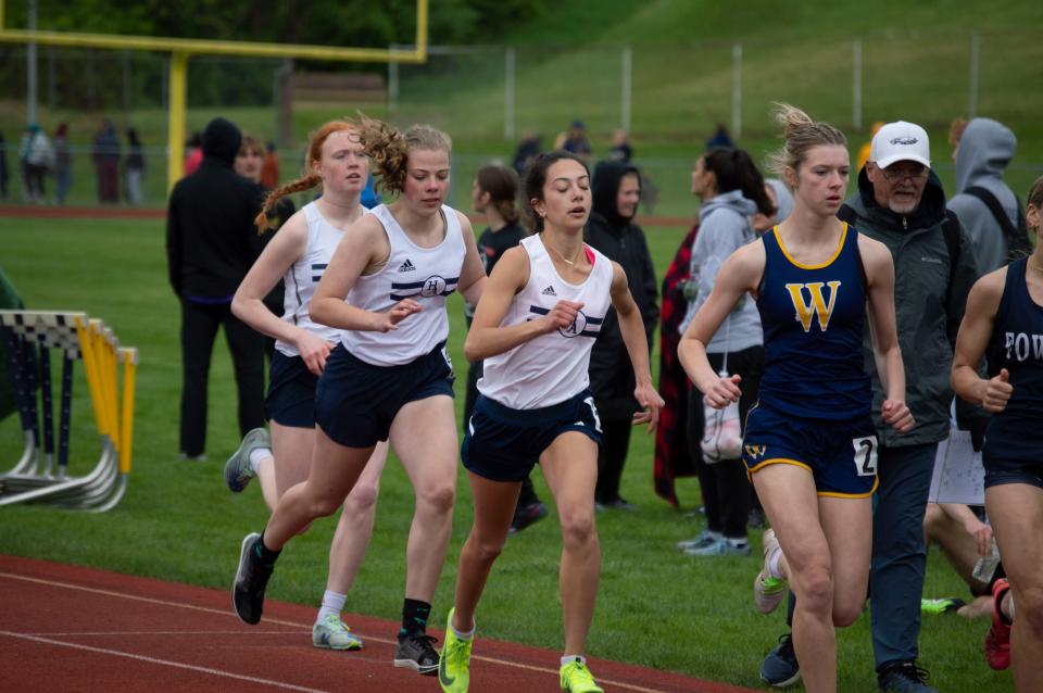 Senior Haven Socha leads a group of Academy runners in the girls 800 meter dash.