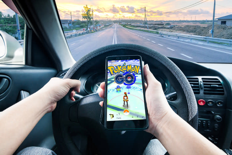 <span class="caption">Pokemon Go, on the road.</span> <span class="attribution"><a class="link " href="http://www.shutterstock.com/pic-452113801/stock-photo-california-united-state-july-2016-hand-holding-a-cellphone-playing-pokemon-go-game-while-driving-indicating-dangerous.html?src=kaMLdGNEHhDTdWsw_XvAmA-1-11" rel="nofollow noopener" target="_blank" data-ylk="slk:Shutterstock;elm:context_link;itc:0;sec:content-canvas">Shutterstock</a></span>