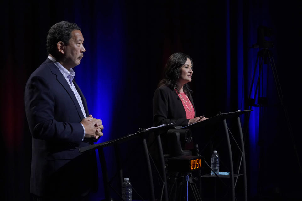 Bruce Harrell, left, and Lorena Gonzalez, right, take part Thursday, Oct. 14, 2021, in the first of two debates in Seattle scheduled before the November election for the office of mayor. (AP Photo/Ted S. Warren, Pool)