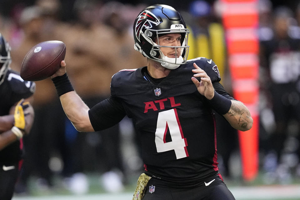 Atlanta Falcons quarterback Taylor Heinicke (4) looks to throw a pass against the Minnesota Vikings during the first half of an NFL football game, Sunday, Nov. 5, 2023, in Atlanta. (AP Photo/Mike Stewart)