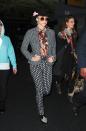 <div class="caption-credit"> Photo by: Getty Images</div>The cowboy hat with pink flower, black and white pantsuit, floral shirt, and bowling shoes Keisha wore at JFK Airport in November 2012 signal that the pop star needs attention, even from 30,000 feet!