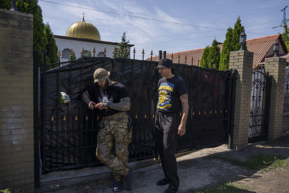 Ukrainian Muslim soldiers leave after prayers on the first day of Eid al-Adha, in Medina Mosque, Konstantinovka, eastern Ukraine, Saturday, July 9, 2022. (AP Photo/Nariman El-Mofty)