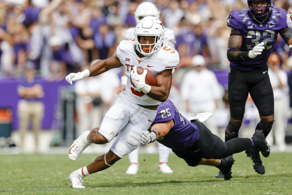 FORT WORTH, TX - OCTOBER 02: Texas Longhorns running back Bijan Robinson (5) runs through the line of scrimmage during the game between the TCU Horned Frogs and the Texas Longhorns on October 2, 2021 at Amon G. Carter Stadium in Fort Worth, Texas. (Photo by Matthew Pearce/Icon Sportswire via Getty Images)