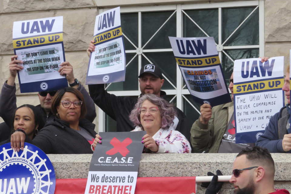 Atlantic City casino workers hold signs during a rally in Trenton, N.J., on April 5, 2024, after the United Auto Workers and casino workers filed a lawsuit challenging New Jersey's clean indoor air law that exempts casino workers from its protections. (AP Photo/Wayne Parry)