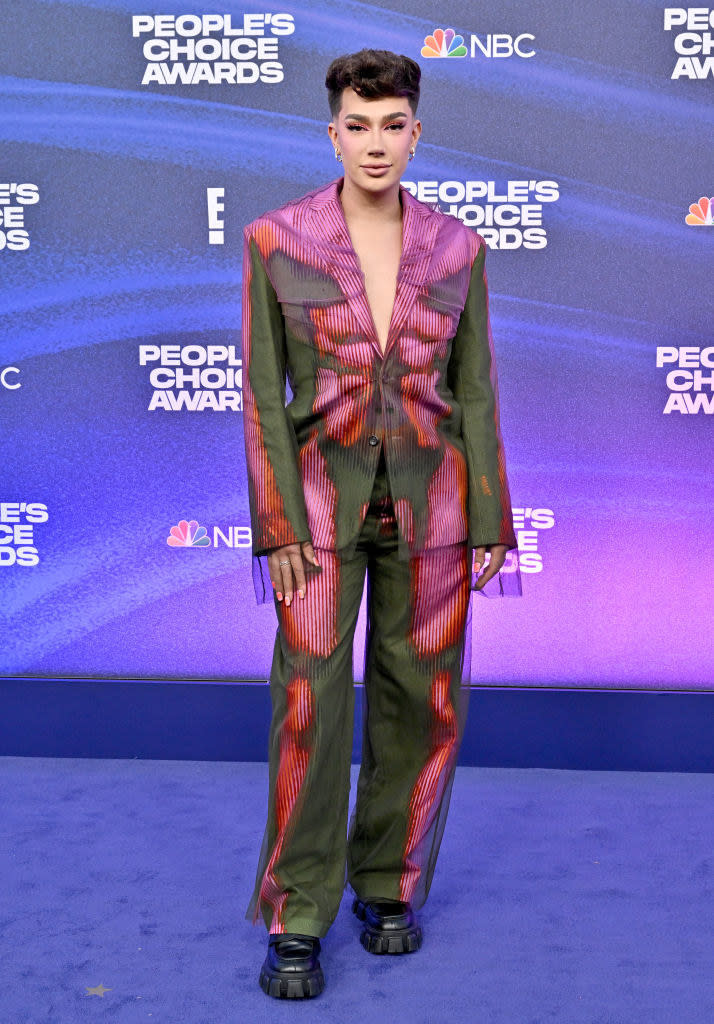 James Charles attends the 2022 People's Choice Awards in a colorful suit