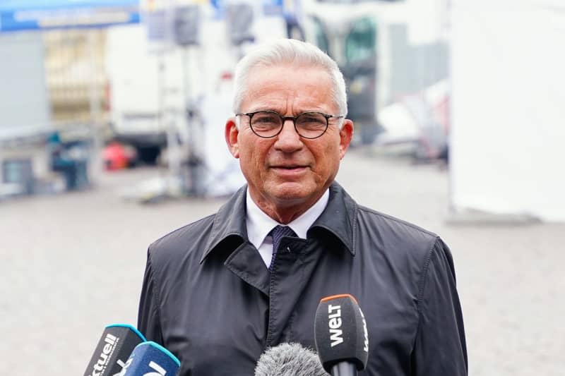 Thomas Strobl, Baden-Wuerttemberg's Minister of the Interior, makes a press statement at the crime scene where a knife-wielding attacker in the German city of Mannheim on Friday targeted a gathering by the anti-Islam right-wing group Pax Europa, according to members of the group. Uwe Anspach/dpa