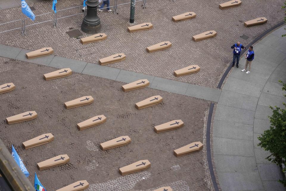 La Scala theatre square is filled with 172 coffins, as many as the number of deaths at work that Lombardy recorded in 2023, during a flash mob organised by UIL trade union organization, in Milan, Italy, Friday, May 10, 2024. (AP Photo/Luca Bruno)