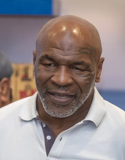 Santa Ana, CA - July 21: Former heavyweight champion and cannabis entrepreneur Mike Tyson signs autographs and takes photos with fans while promoting his Tyson Ranch brand at Planet 13 dispensary in Santa Ana on Wednesday, July 21, 2021. (Allen J. Schaben / Los Angeles Times)