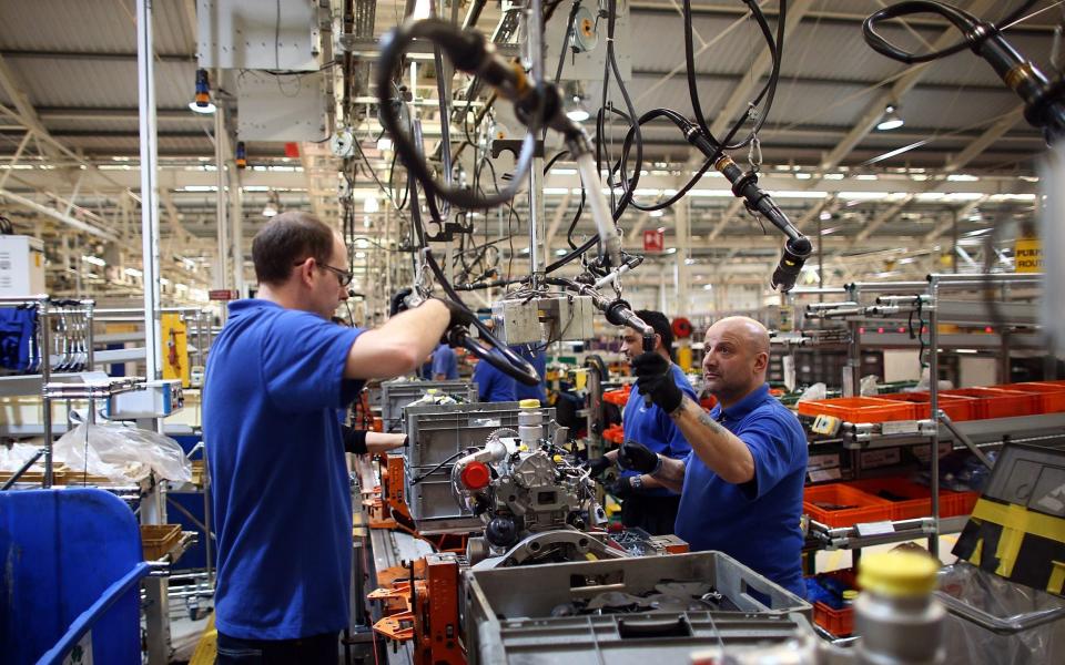 Ford workers on the engine production line in Dagenham