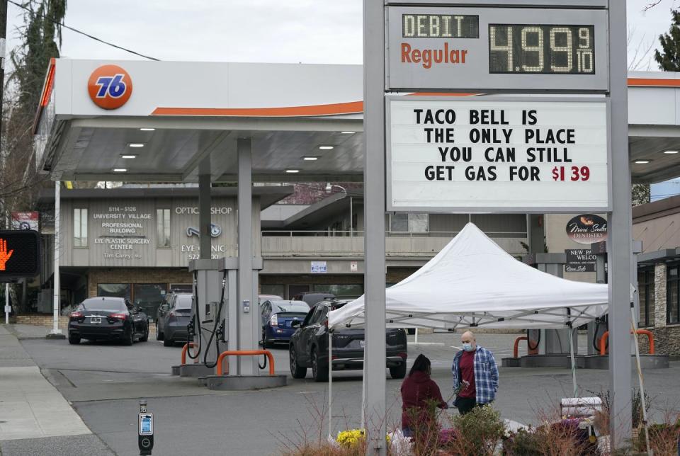 <span class="caption">Gas station in Seattle on March 11, 2022.</span> <span class="attribution"><a class="link " href="https://newsroom.ap.org/detail/WashingtonGasPrices/ea950a59ec6d4e859fb8f87eb4d23d48/photo" rel="nofollow noopener" target="_blank" data-ylk="slk:AP Photo/Ted S. Warren;elm:context_link;itc:0;sec:content-canvas">AP Photo/Ted S. Warren</a></span>