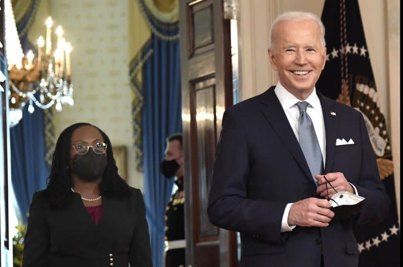 U.S. President Joe Biden (R) escorts Judge Ketanji Brown Jackson in Feb. 2022 at the White House to announce his decision to nominate her to be the country's first Black woman to sit on the high court. The Senate on Wednesday is set to vote to confirm Biden's 200th judge. File Photo by Mike Theiler/UPI