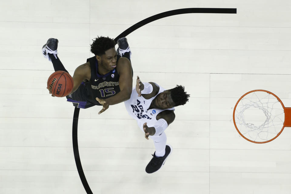 <p>Noah Dickerson #15 of the Washington Huskies shoots over Neemias Queta #23 of the Utah State Aggies in the first round of the 2019 NCAA Men’s Basketball Tournament held at Nationwide Arena on March 22, 2019 in Columbus, Ohio. </p>