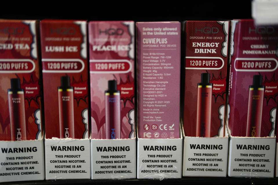 Disposable electronic cigarette devices made by the Chinese brand HQD are displayed for sale at Vapes N Smoke in Pinecrest, Fla., Monday, June 26, 2023. Since 2020, the number of different e-cigarette devices for sale in the U.S. has exploded to more than 9,000, a nearly three-fold increase driven almost entirely by a wave of disposable vapes from China. (AP Photo/Rebecca Blackwell)