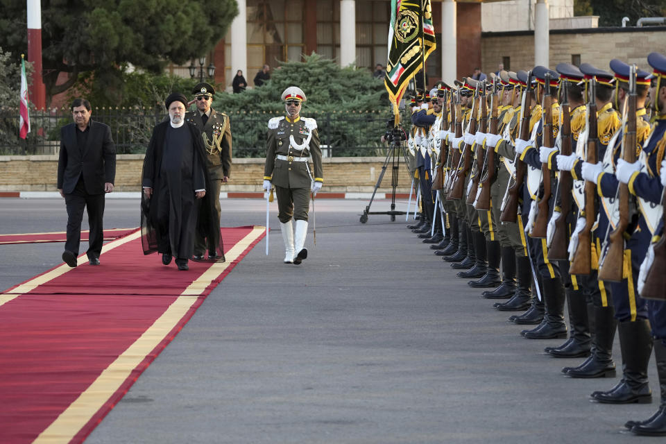 Iranian President Ebrahim Raisi, second left, reviews an honor guard during his official departure ceremony as he leaves Tehran's Mehrabad airport to New York to attend annual UN General Assembly meeting, Monday, Sept. 19, 2022. Raisi headed to New York on Monday, where he will be speaking to the U.N. General Assembly later this week, saying that he has no plans to meet with President Joe Biden on the sidelines of the U.N. event. (AP Photo/Vahid Salemi)