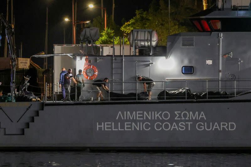 FILE PHOTO: Families of migrants missing after a boat disaster off Greece plead for recovery of bodies