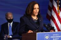 <p>The 56-year-old paired a deep blue satin top with a navy blazer and string of pearls in Delaware to announce new cabinet nominations.</p>