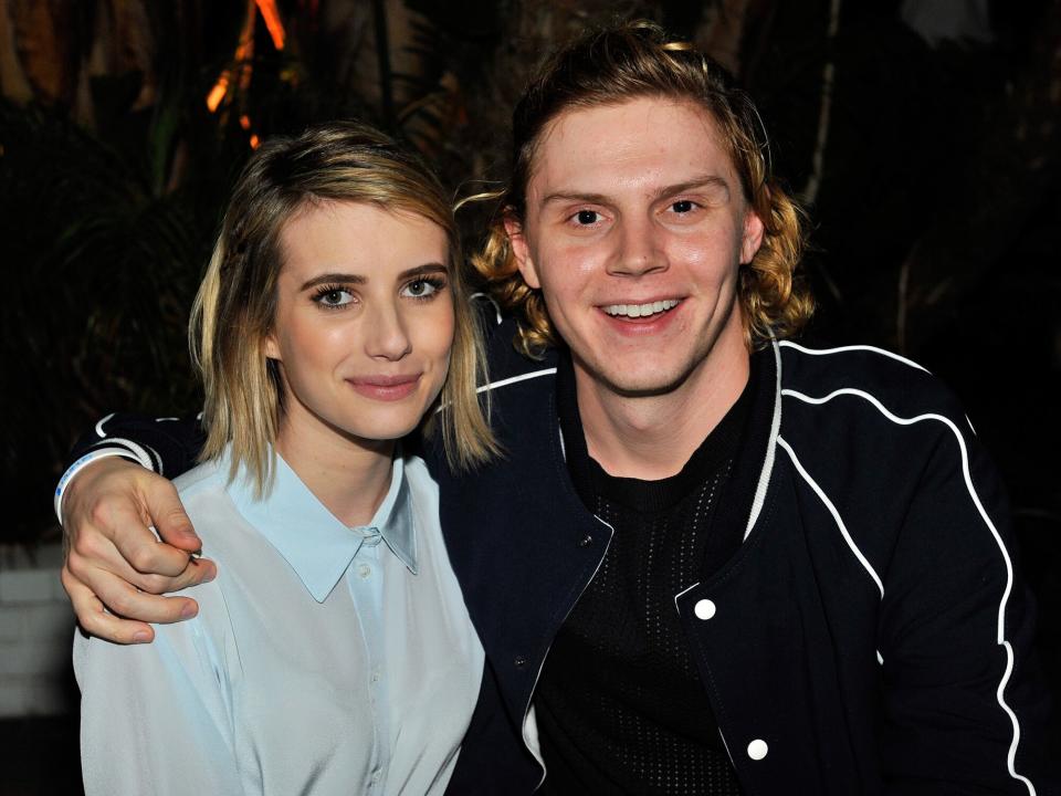 Emma Roberts (L) and Evan Peters attend the Sandro Paris celebration at Chateau Marmont with a special performance by Polica at Chateau Marmont on March 20, 2014 in Los Angeles, California