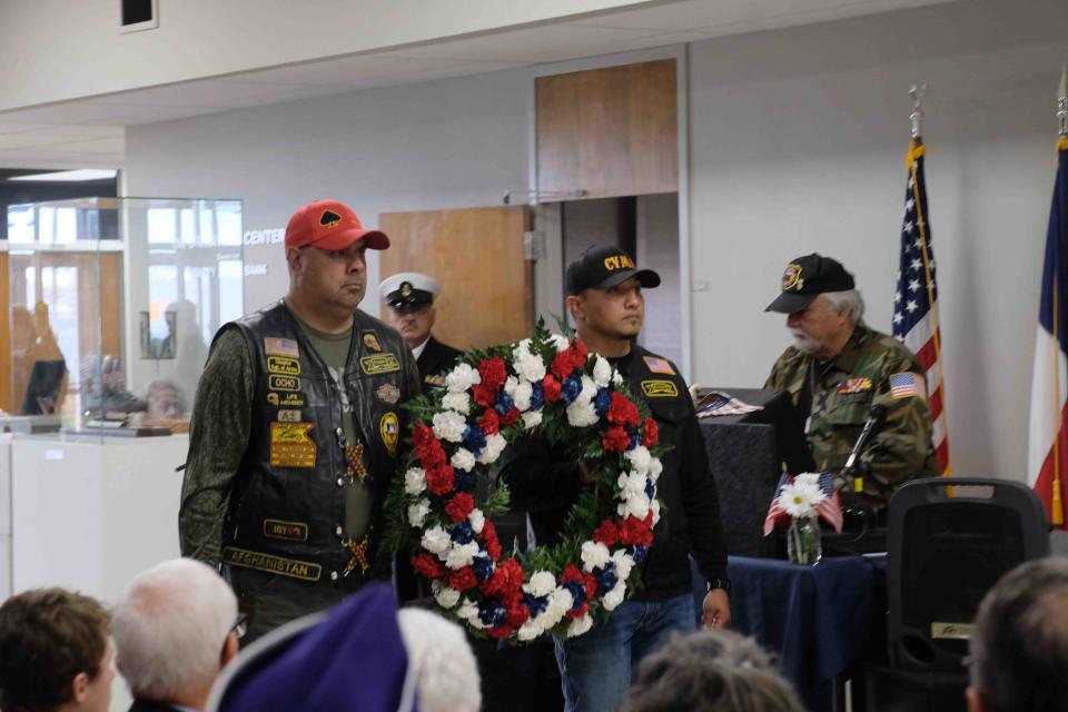Two members of the Combat Veterans Association present the wreath Friday during the Veterans Day Ceremony  Friday at the Texas Panhandle War Memorial Center in Amarillo.