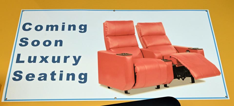 A sign at Entertainment Cinemas in South Dennis advertises the new recliner seats that are expected to be installed in all the theaters by the holiday season.