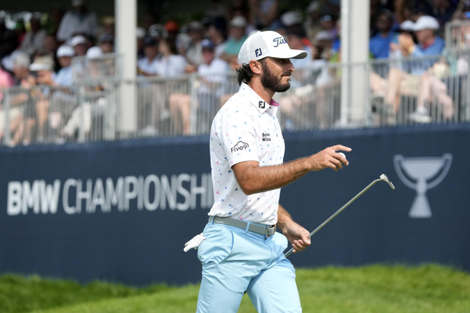 Max Homa acknowledges the crowd's applause after his birdie on the 15th green during the second round of the BMW Championship golf tournament, Friday, Aug. 18, 2023, in Olympia Fields, Ill. (AP Photo/Charles Rex Arbogast)