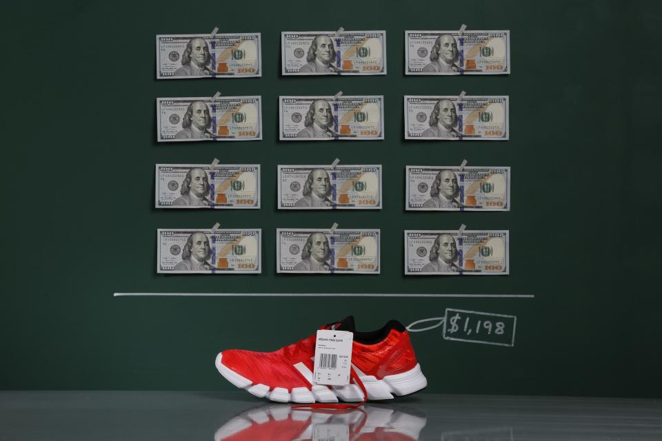 An Adidas Adipure Crazy running shoe as photographed in a studio with an illustrative price tag of $1,198 in Caracas