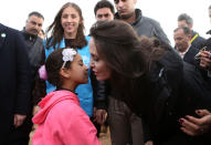 <p>The actress-activist and special envoy of the U.N. refugee agency held a press conference Sunday at the Zaatari camp for Syrian refugees in Zaatari, Jordan. Jolie spoke in the camp, which is made up of hundreds of rows of caravans, after meeting with Syrian refugees. The Hollywood star called for a political solution to Syria’s civil war, saying that “humanitarian aid is not a long-term solution.” (Photo: Salah Malkawi/ Getty Images) </p>