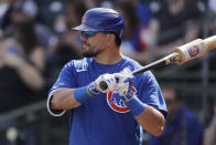 FILE - In this Feb. 27, 2020, file photo, Chicago Cubs' Kyle Schwarber prepares to bat during the second inning of a spring training baseball game against the Texas Rangers, in Surprise, Ariz. The minute word leaked that the designated hitter was coming to the National League this season, fans and front offices alike began pinpointing the perfect candidates. (AP Photo/Charlie Riedel, File)