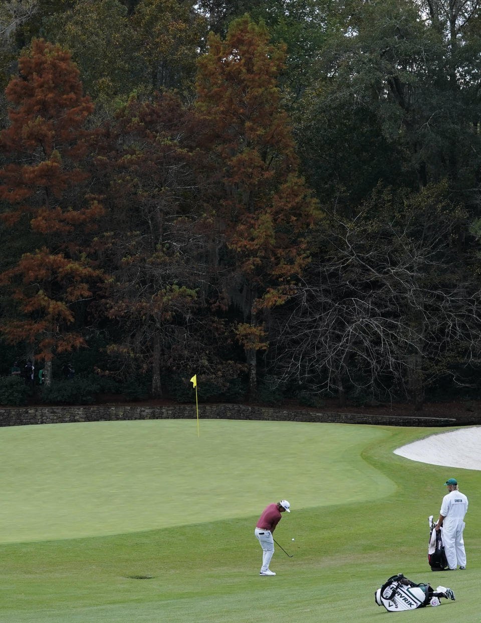 Cameron Smith, of Australia, chips to the 11th green during the final round of the Masters golf tournament Sunday, Nov. 15, 2020, in Augusta, Ga. (AP Photo/David J. Phillip)