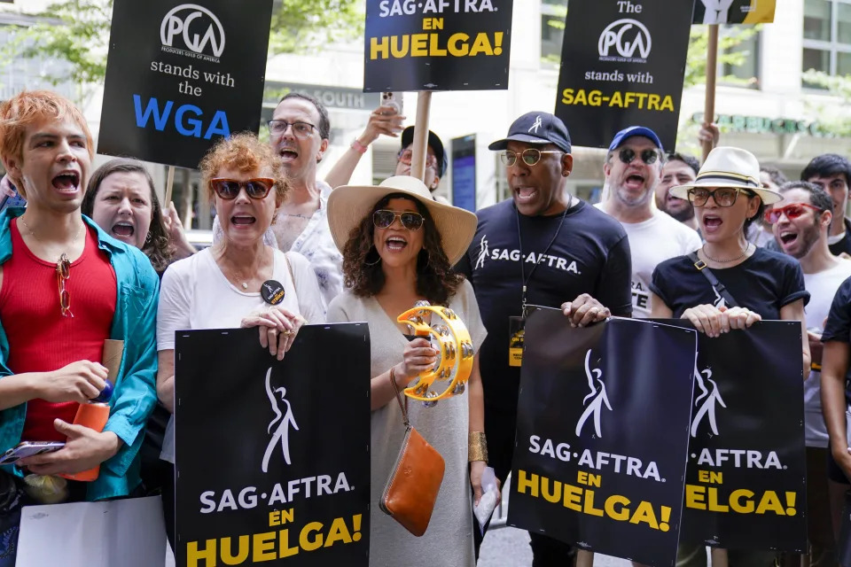 Hollywood actors Susan Sarandon, second from left, Rosie Perez, third from right, Ezra Knight, second from right, and Julianna Margulies, chant slogans as they participate in a picket line outside Warner Bros., Discovery, and Netflix offices in Manhattan, Friday, Aug. 18, 2023. The WGA and SAG-AFTRA held a joint Latine Picket, presented by the WGAE Latine Writers Salon, the WGAW Latinx Writers Committee, and the SAG-AFTRA National Latino Committee. (AP Photo/Mary Altaffer)